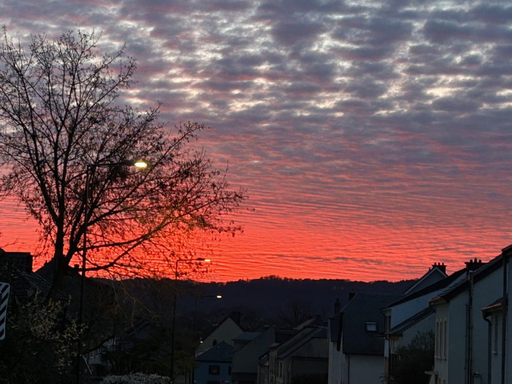 A Fiery Canvas in Luxembourg: Understanding the Red Sunset